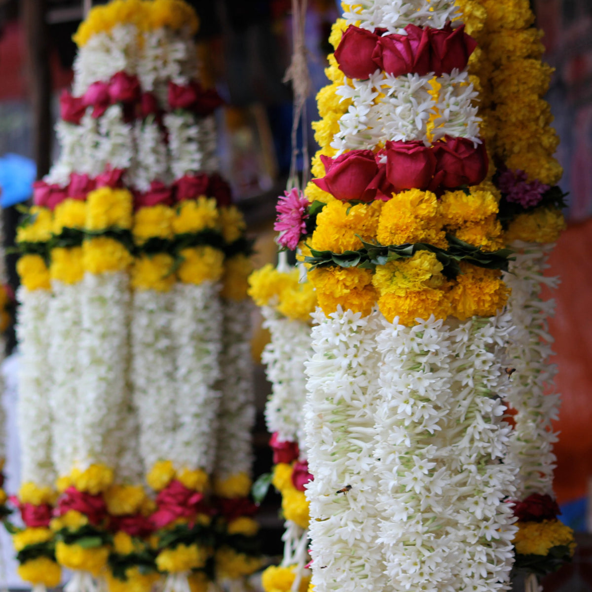 Tuberose wedding garlands with red rose and marigold bands